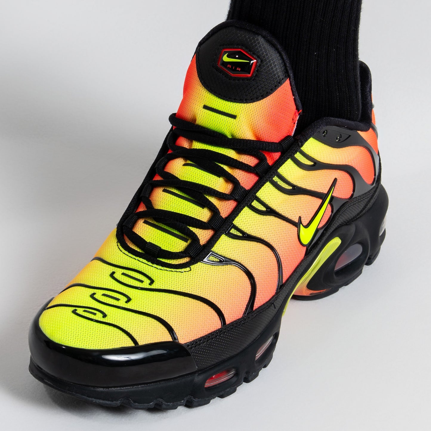Nike Air Max Plus - Black / Solar Red / Volt